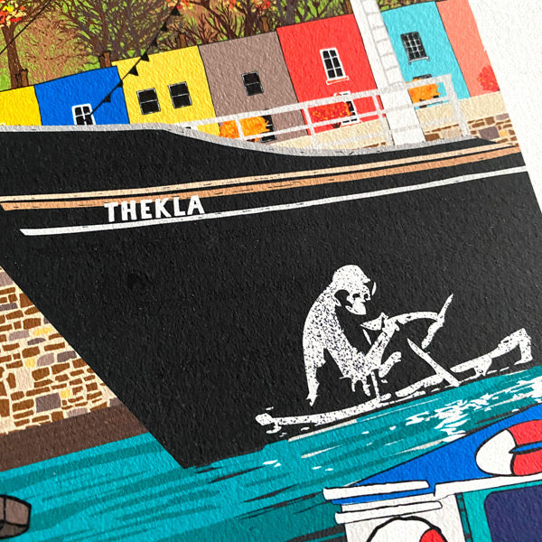 colourful bristol houses behind thekla boat